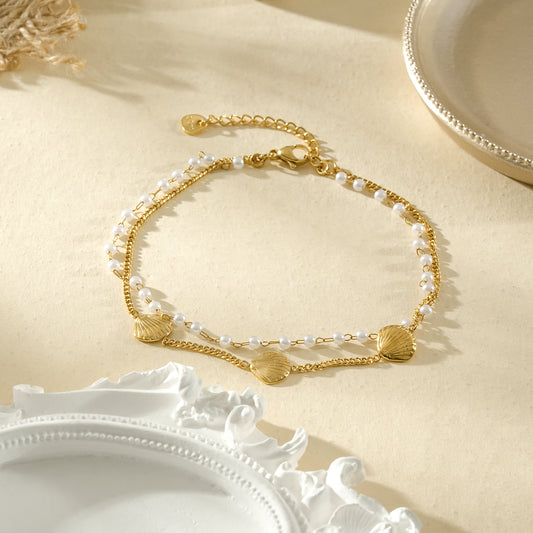 Chaîne de cheville dorée double rang perles et coquillages