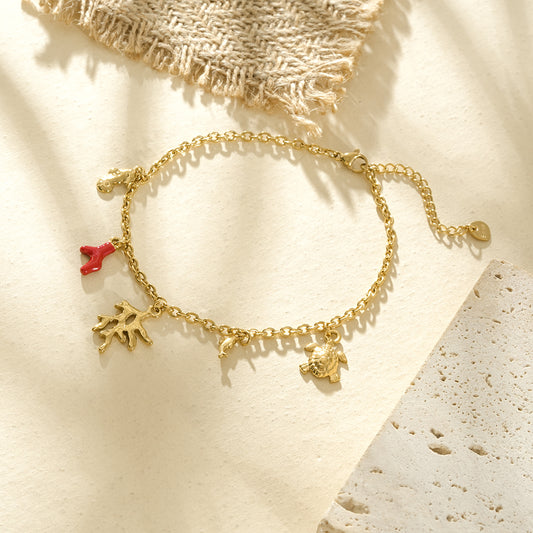 Chaîne de cheville dorée avec corail rouge et doré