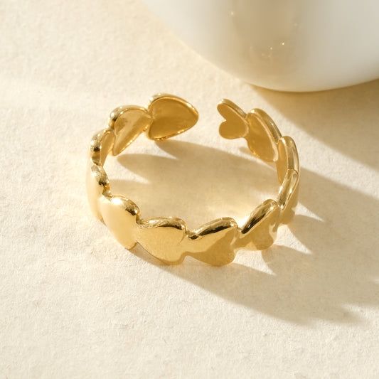 Bague d’orteil dorée ajustable à cœurs lisses