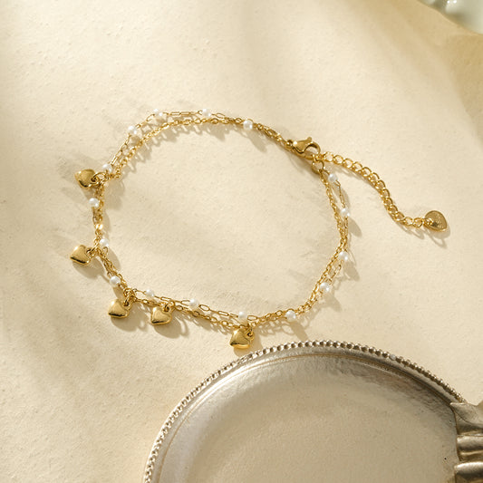 Chaîne de cheville dorée double rang cœurs et perles