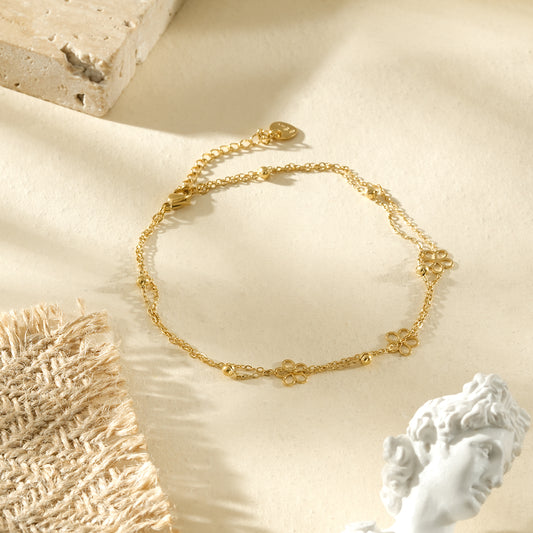 Chaîne de cheville dorée minimaliste à fleurs ajourées