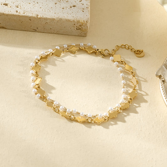 Chaîne de cheville dorée à perles et motifs ondulés