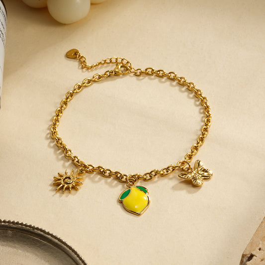 Chaîne de cheville triple pendentifs citron et papillon