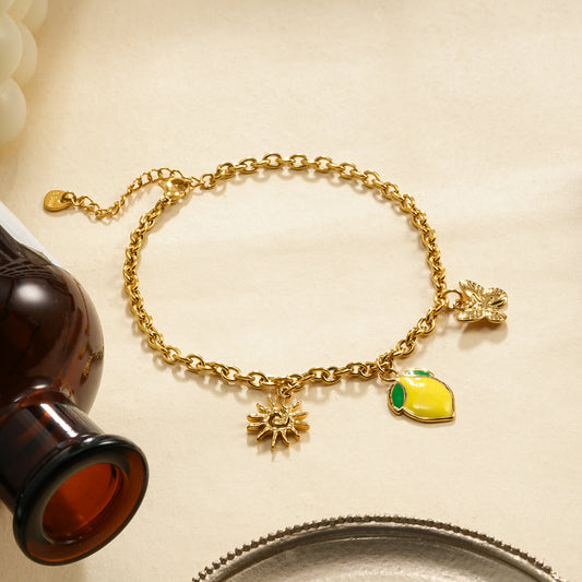 Chaîne de cheville triple pendentifs citron et papillon