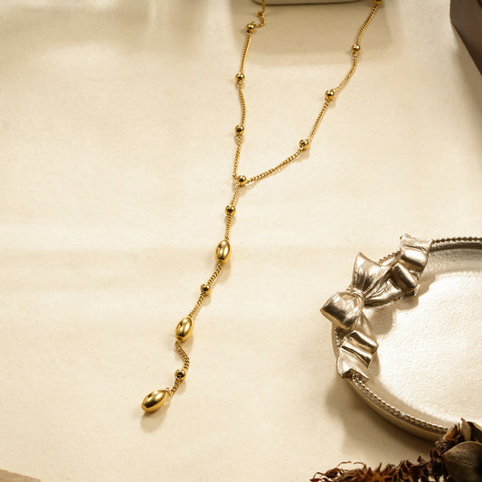 Collier en Y Chaîne Perlée Dorée Boules Sphères