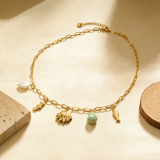 Collier chaîne dorée avec charms éléments marins