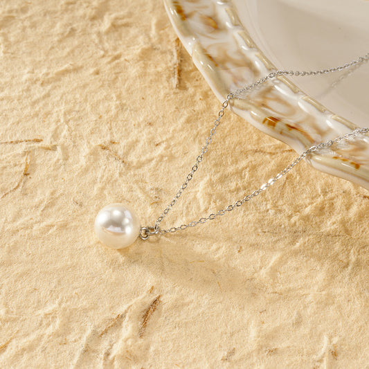 Collier argenté chaîne fine pendentif perle blanche sphère