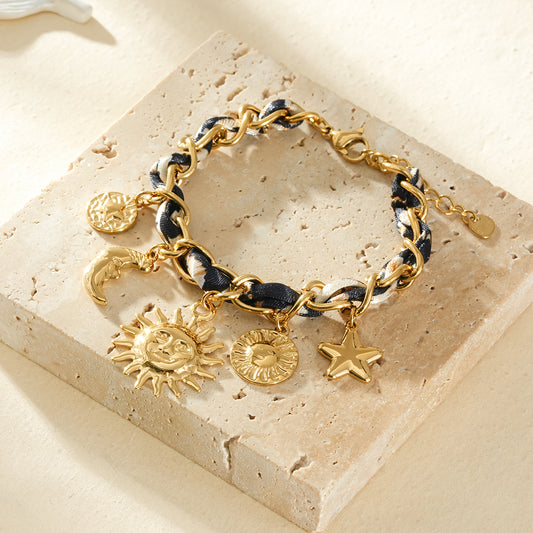 Bracelet doré chaîne torsade de ruban léopard breloque constellation