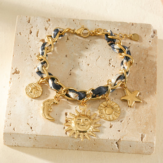 Bracelet doré chaîne torsade de ruban léopard breloque constellation