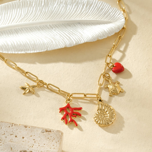 Collier doré pendentifs corail rouge, coquillage et cœur
