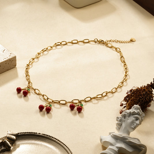Collier chaîne maillons dorés triple cerise