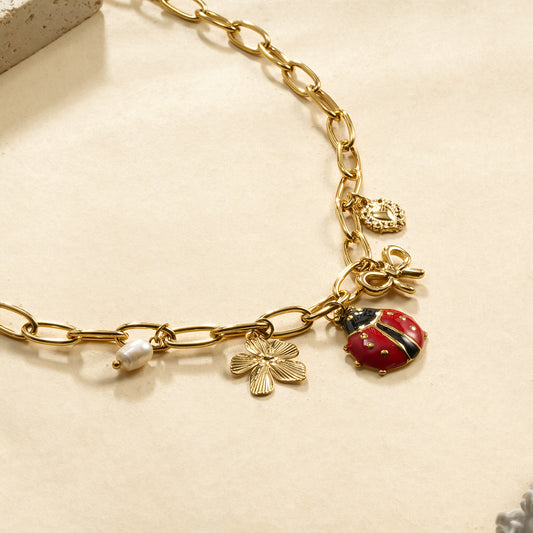 Collier chaîne dorée maillons coccinelle