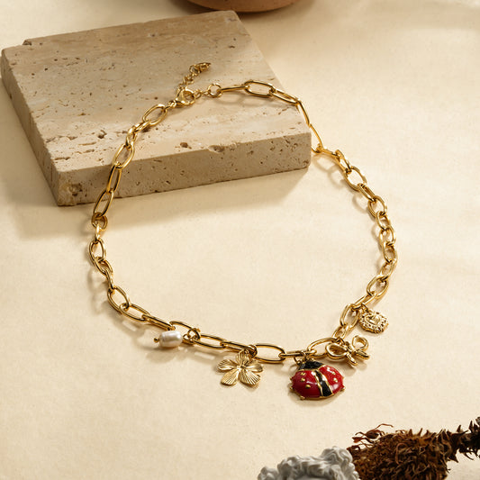 Collier chaîne dorée maillons coccinelle