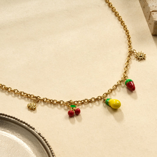 Collier chaîne dorée breloques fruits et soleil