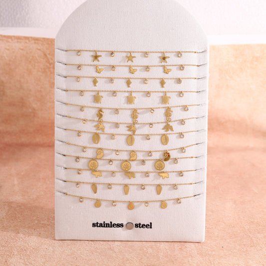 Lot de 12 colliers dorée thème océan sur présentoir