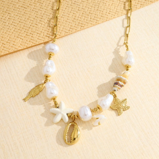 Collier doré perles et coquillage, étoile de mer et poisson