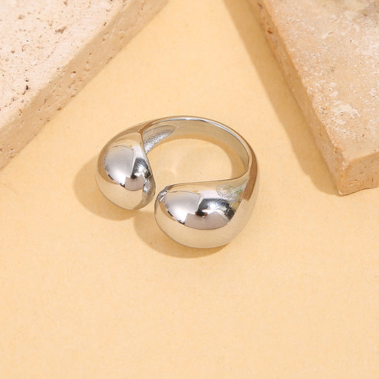 Bague dorée ouverture sur le devant avec formes arrondi effet miroir