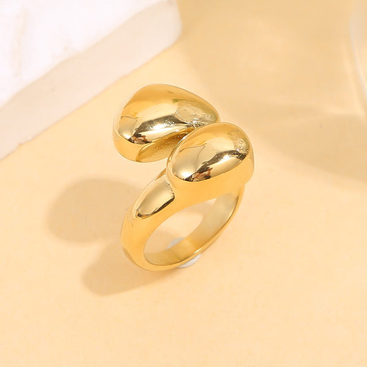 Bague dorée ouverte forme arrondi galbées effet miroir