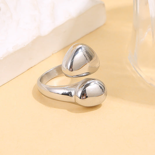 Bague argentée ouverte forme arrondi galbées effet miroir
