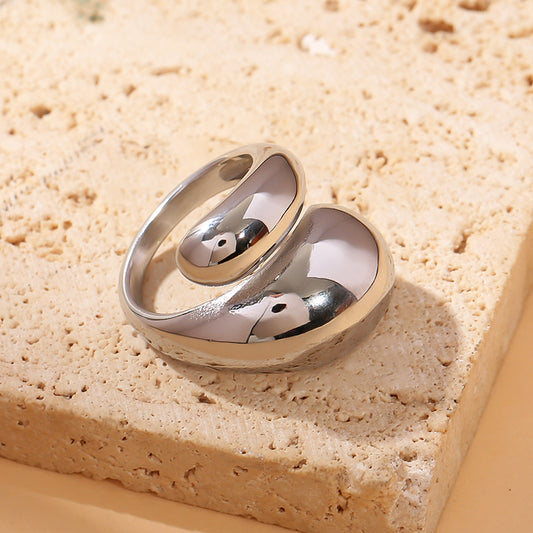 Bague argentée ouverte devant croisée effet arrondi miroir