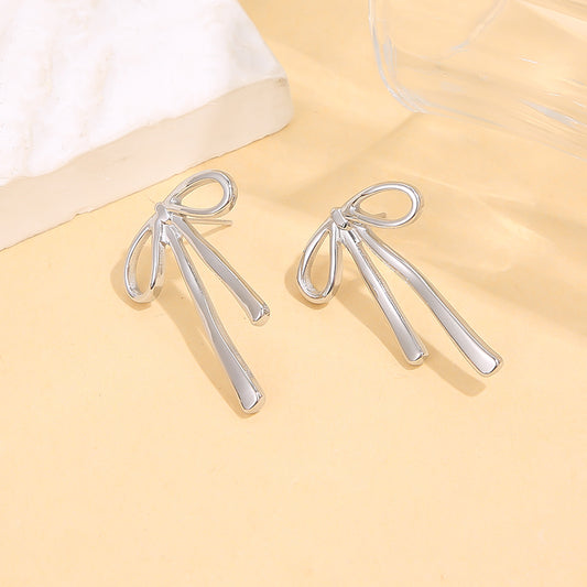 Boucles d'oreilles argentées nœuds rigide fils pendants effet miroir