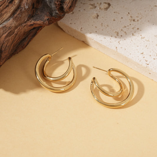 Boucles d'oreilles dorées créoles doubles arrondies effet miroir