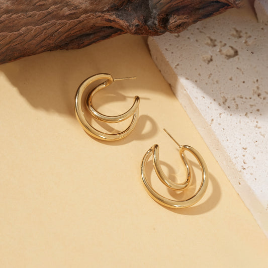 Boucles d'oreilles dorées créoles doubles arrondies effet miroir