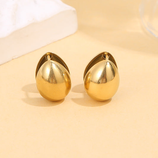 Boucle d'oreilles dorées en forme de goutte sculptée effet miroir