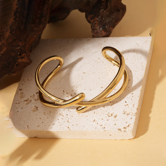 Bracelet jonc ajustable doré à branches croisées