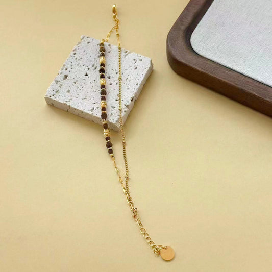 Bracelet double chaîne pierres onyx et dorées texturés