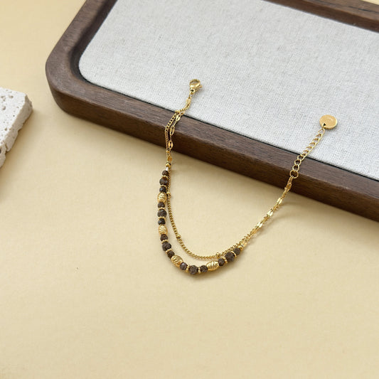 Bracelet double chaîne pierres onyx et dorées texturés