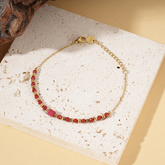 Bracelet doré chaîne fine avec pierres et pierre centrale cylindrique