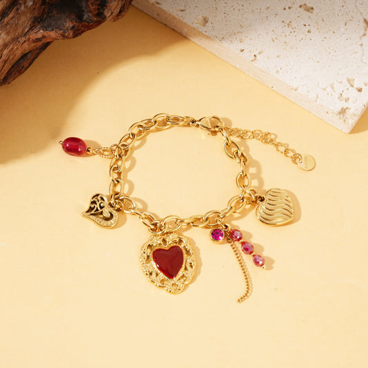 Bracelet doré pendentifs cœurs ex-voto pierres rouge