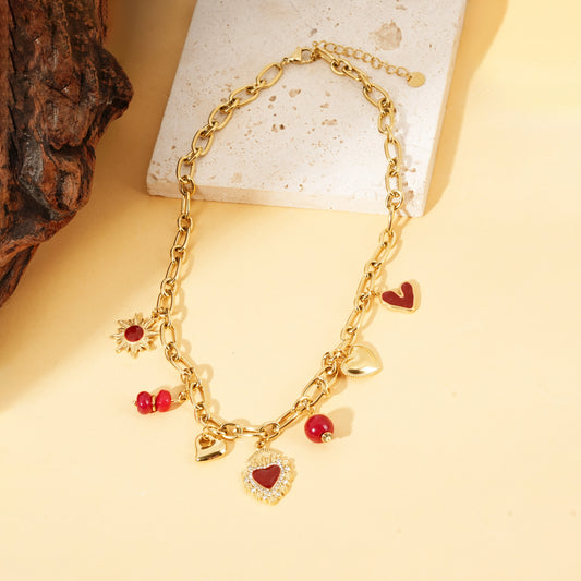 Collier chaîne dorée pendentifs cœurs ex-voto perles rouge
