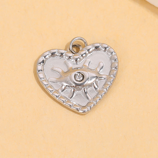 Lot de 3 pendentifs argentés cœur avec œil strass