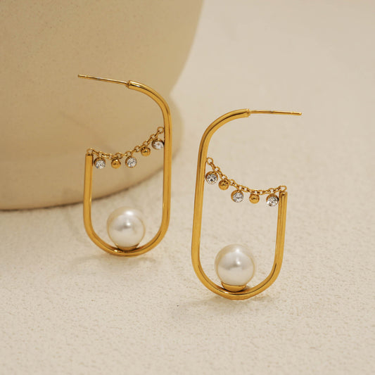 Boucles d'oreilles dorées créoles ovale allongé perle et strass