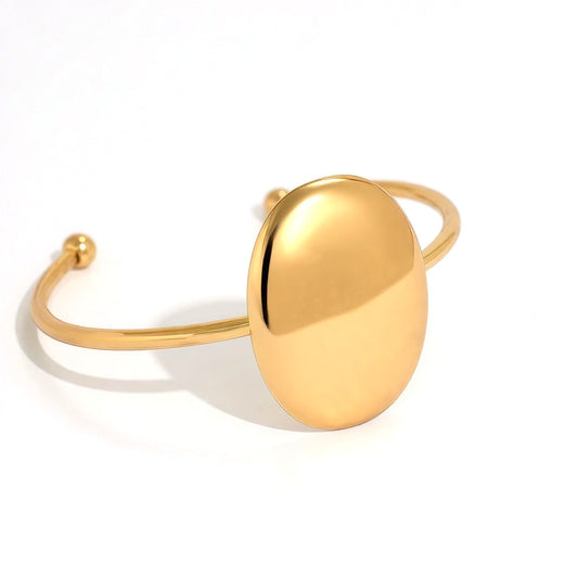 Bracelet machette dorée fine ovale bombé poli