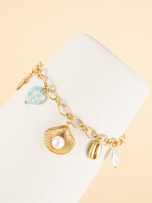Bracelet chaîne dorée breloques de la mer bleu