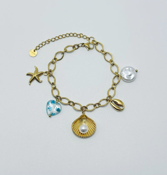 Bracelet chaîne dorée breloques de la mer bleu
