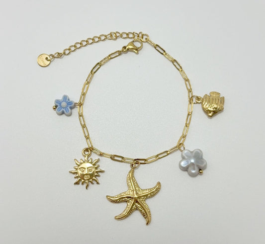 Bracelet chaîne dorée breloques de la mer et fleurs