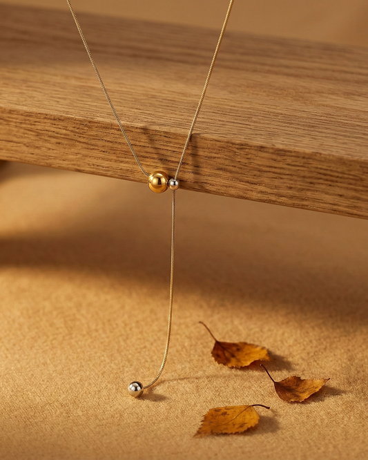 Collier en Y bi-colore argenté et doré billes coulissantes