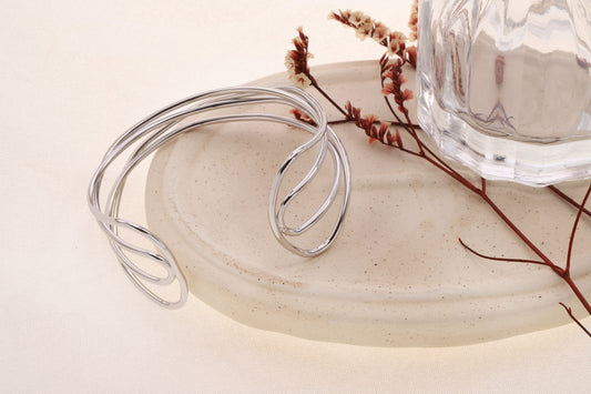 Bracelet manchette argentée ajustable 4 branches entrelacés