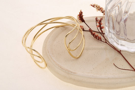 Bracelet manchette dorée ajustable 4 branches entrelacés