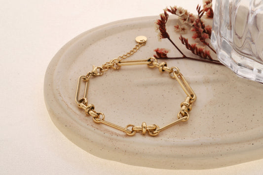Bracelet doré chaîne maillons longs ovales et anneaux ronds intercalés