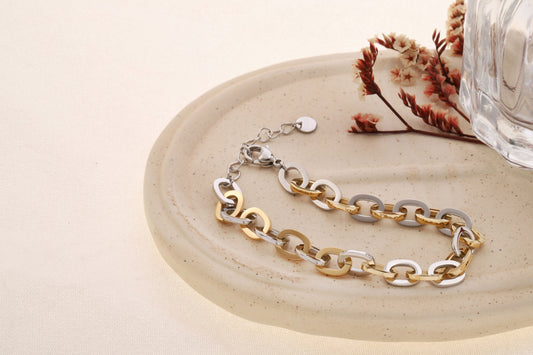 Bracelet bicolore doré et argenté, maillons ovales plats entrelacés à effet poli miroir