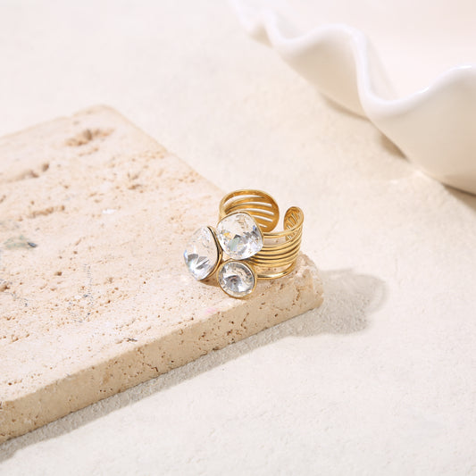 Bague ajustable dorée 7 branches 3 strass formes variées