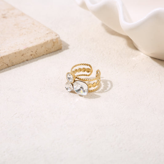 Bague ajustable dorée triple branches 3 strass formes variées