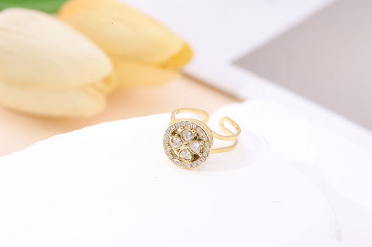 Bague dorée ajustable anti stress cercle fleur 4 pétales strassées anneau tournante