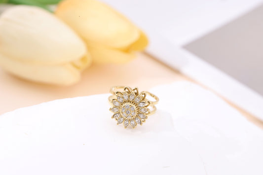 Bague dorée ajustable anti stress fleur 14 pétales strassées tournante