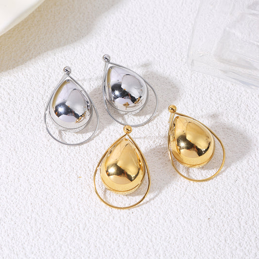 Boucles d’oreilles dorées pendantes gouttes bombées cerclées d’un anneau fin